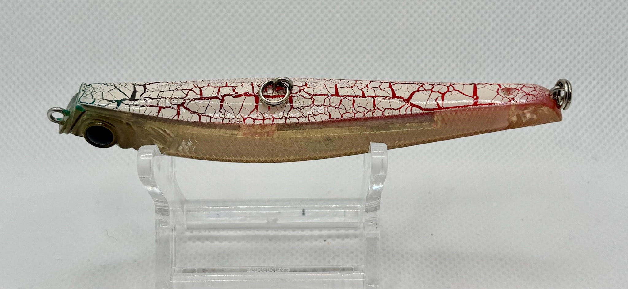 Shell Japan Imagine 101 Crackle Red Clear – top/dorsal view showing red crackle pattern over clear body and gold/olive back