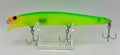 Feed Popper 128mm Ghost Chartreuse – side A showing translucent chartreuse body with orange head and treble hooks