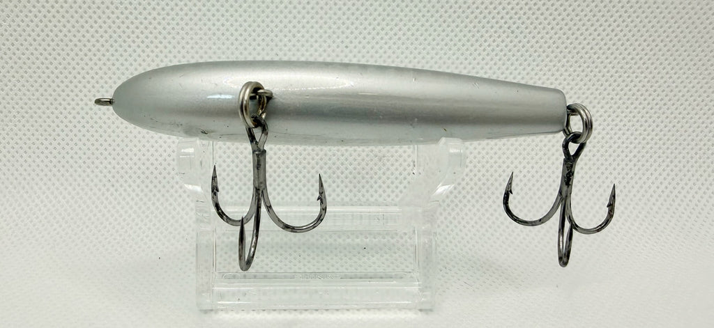 PDG 80mm stickbait – plain silver pearl colourway showing body shape and hook hangers