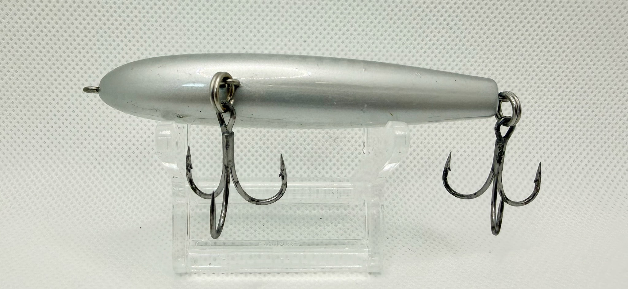 PDG 80mm stickbait – plain silver pearl colourway showing body shape and hook hangers