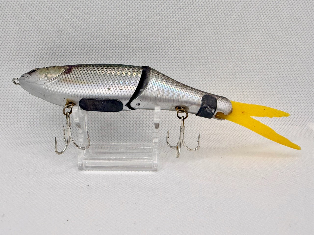 Japanese imported jointed swimbait – belly view showing silver underside, twin treble hooks and yellow tail