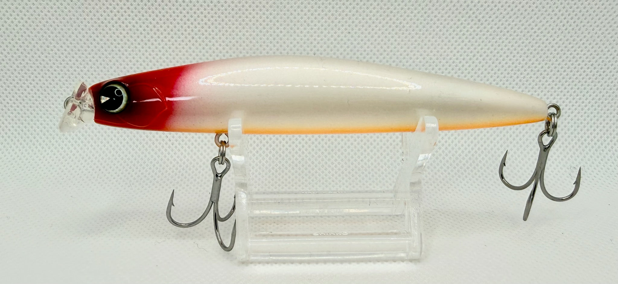 ima Kosuke 110F floating minnow Red Head Pearl – side A showing pearl white body with red head, orange belly stripe and treble hooks