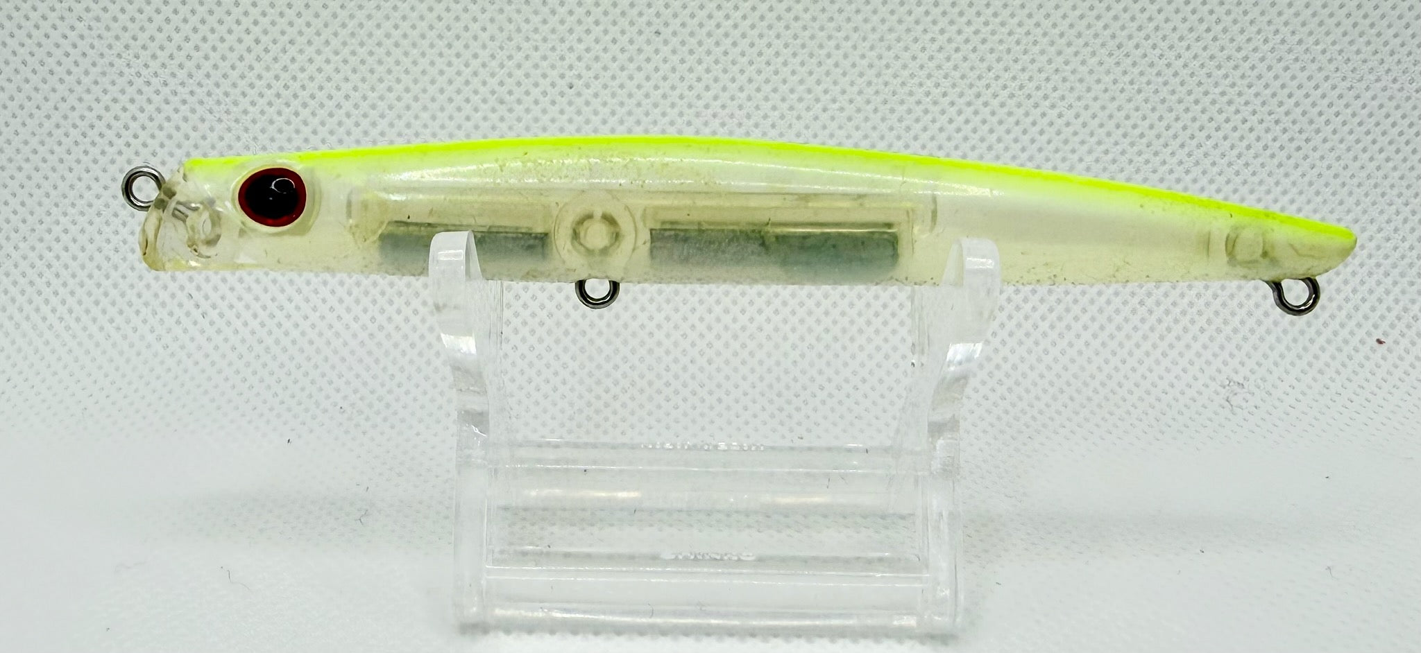 Daiwa Morethan Lazy Slim S-LV floating pencil Chartreuse Ghost – side A showing chartreuse back, translucent pearl body and red eye