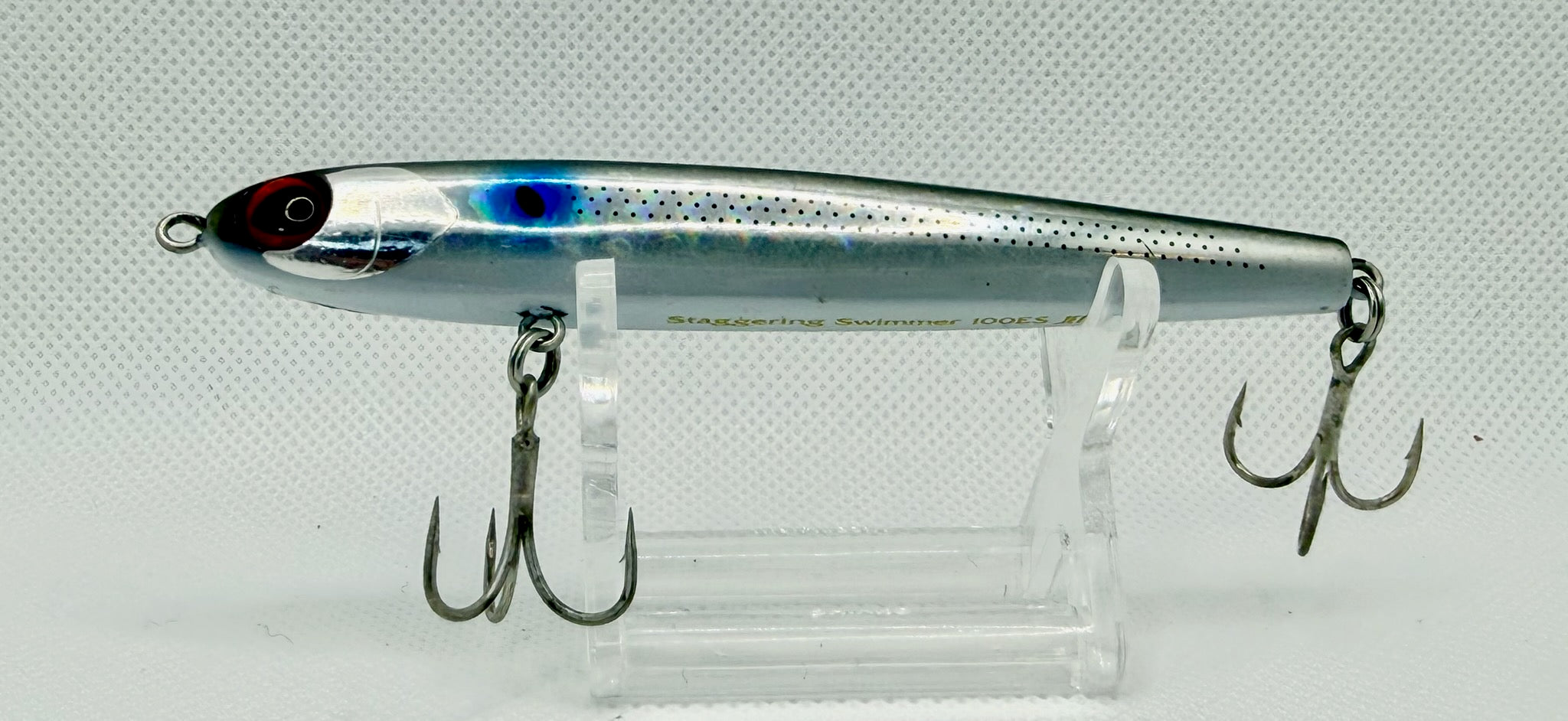 Jetboil Staggering Swimmer 100ES Blue Sardine – side A showing silver chrome body with blue lateral flash, black dot pattern and red eye