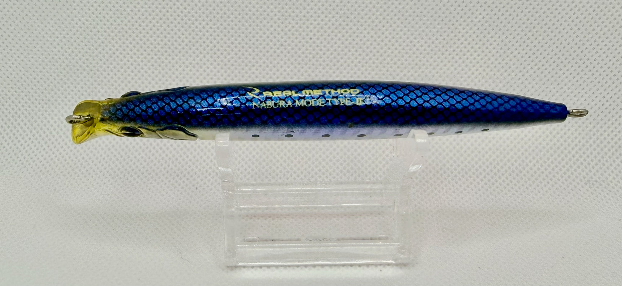 Real Method Nabura Mode Type II – body detail showing Real Method Nabura Mode Type II gold text